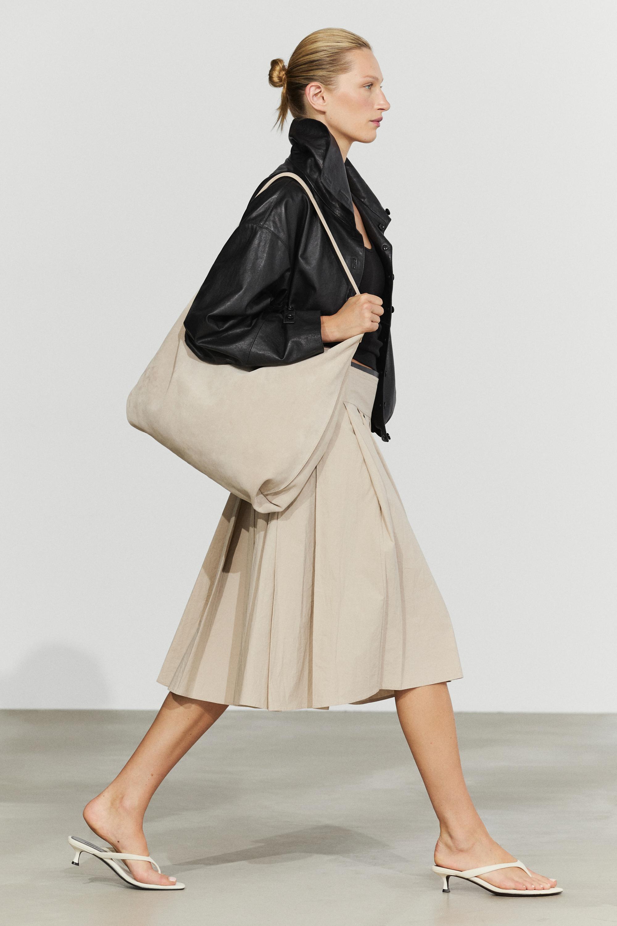 Pleated midi skirt with contrasting sash